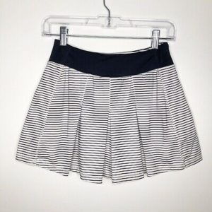 Kyodan white and black striped, flared tennis skirt for athletic women with a small waist