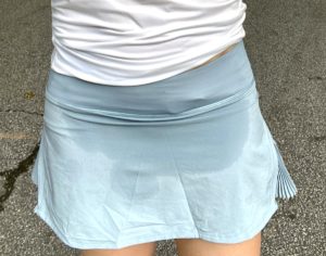 Play off the Pleats tennis skirt by Lululemon in Blue Cast with a picture on a girl in size 6 after running and tennis