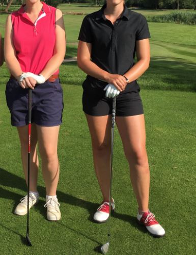 golf outfit for women with black or navy shorts and a collared shirt