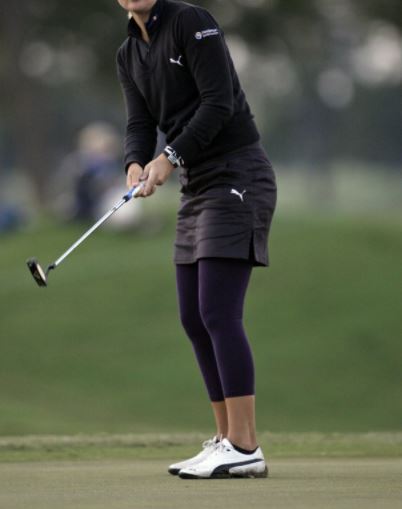 women's golfing outfit for cold weather with a skirt over leggings